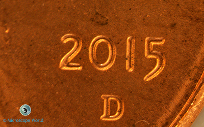 Penny under the stereo zoom microscope at 20x. Penny Under Stereo Microscope at 20x magnification