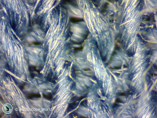 Fabric weave captured under the stereo zoom microscope. Fabric weave under microscope