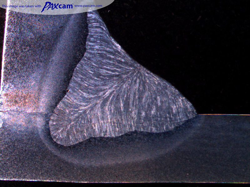 Weld Section under weld inspection microscope Weld Section under weld inspection microscope