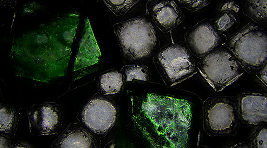 Salt captured under the microscope using darkfield microscopy. Darkfield miroscope image of salt.